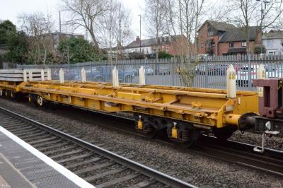 image showing a large yellow on-track machine