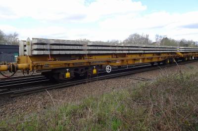 image showing a large yellow on-track machine