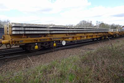 image showing a large yellow on-track machine