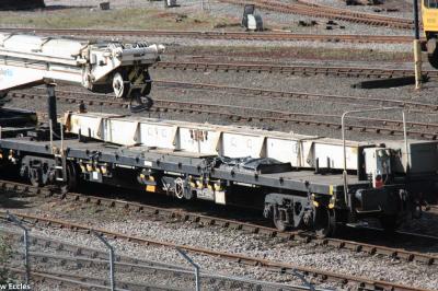 image showing a large yellow on-track machine