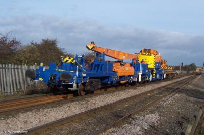 image showing a large yellow on-track machine