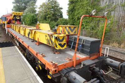 image showing a large yellow on-track machine