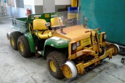 image showing a large yellow on-track machine