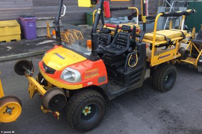 image showing a large yellow on-track machine