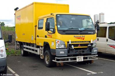 image showing a large yellow on-track machine