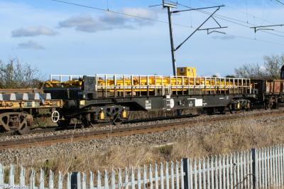 image showing a large yellow on-track machine
