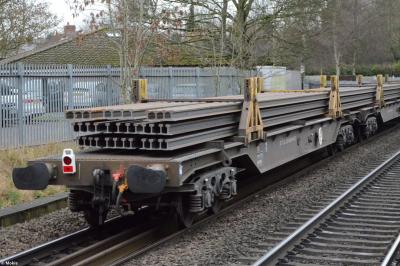 image showing a large yellow on-track machine