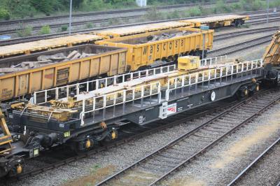 image showing a large yellow on-track machine