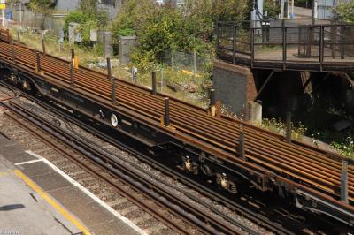 image showing a large yellow on-track machine