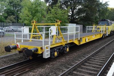 image showing a large yellow on-track machine