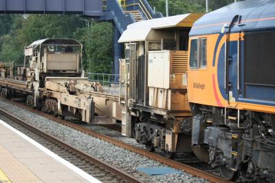 image showing a large yellow on-track machine