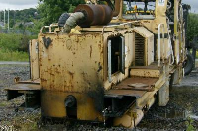 image showing a large yellow on-track machine