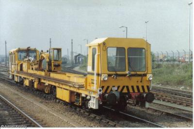 image showing a large yellow on-track machine