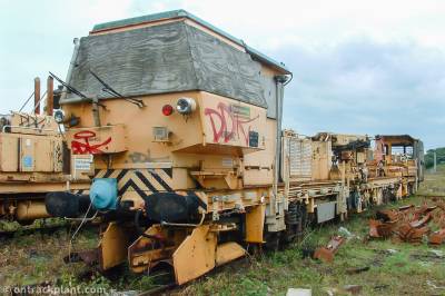 image showing a large yellow on-track machine