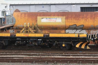 image showing a large yellow on-track machine