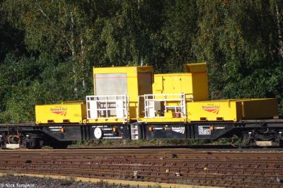 image showing a large yellow on-track machine