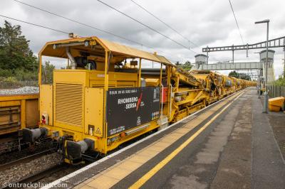 image showing a large yellow on-track machine