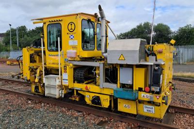 image showing a large yellow on-track machine