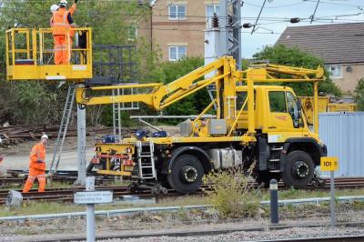 image showing a large yellow on-track machine