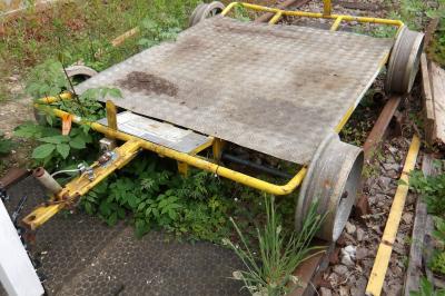 image showing a large yellow on-track machine