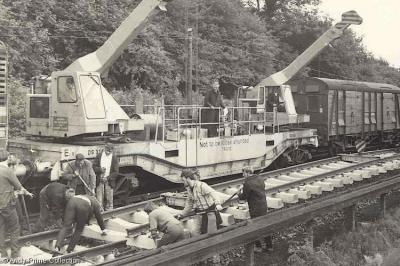 image showing a large yellow on-track machine