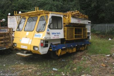 image showing a large yellow on-track machine