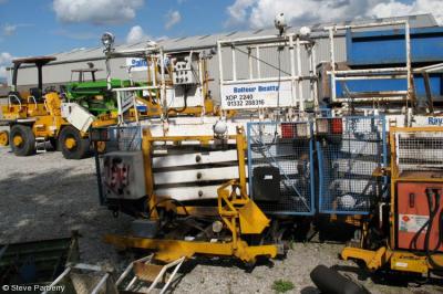 image showing a large yellow on-track machine