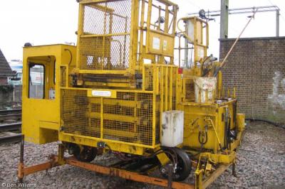 image showing a large yellow on-track machine