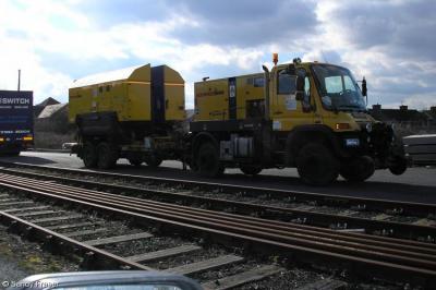 image showing a large yellow on-track machine