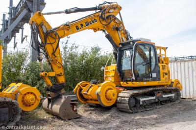 image showing a large yellow on-track machine