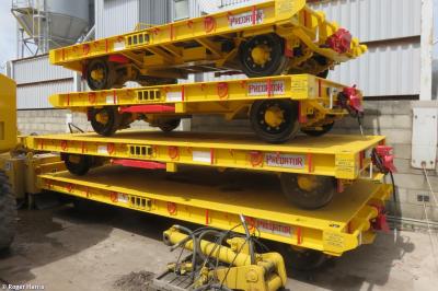 image showing a large yellow on-track machine