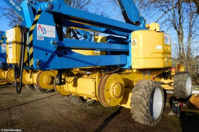 image showing a large yellow on-track machine