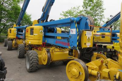 image showing a large yellow on-track machine