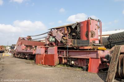 image showing a large yellow on-track machine