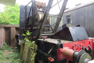 image showing a large yellow on-track machine