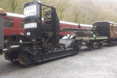 image showing a large yellow on-track machine