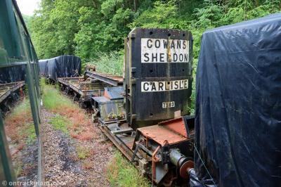 image showing a large yellow on-track machine