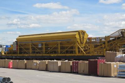 image showing a large yellow on-track machine