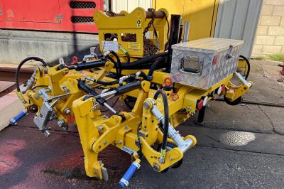 image showing a large yellow on-track machine