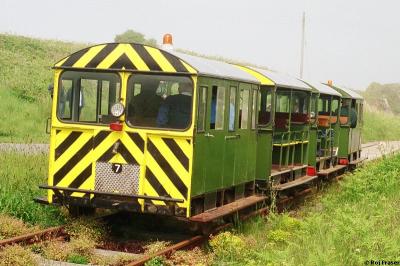 image showing a large yellow on-track machine
