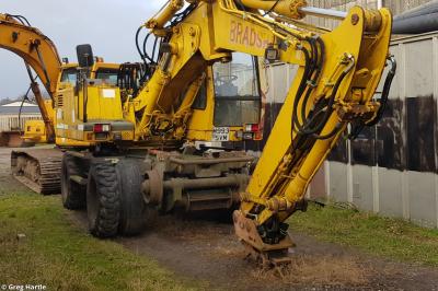 image showing a large yellow on-track machine