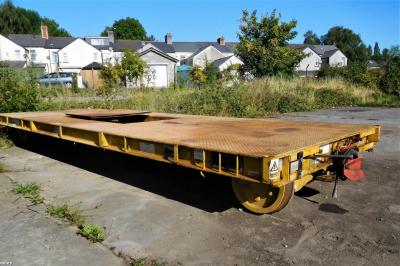 image showing a large yellow on-track machine