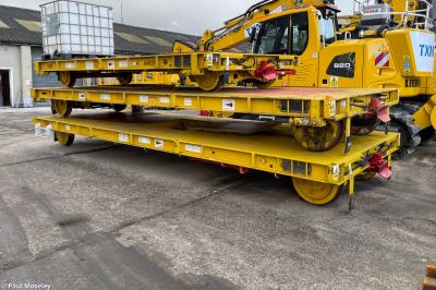 image showing a large yellow on-track machine