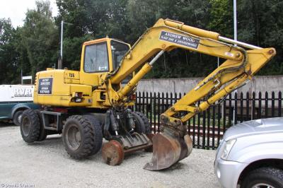 image showing a large yellow on-track machine