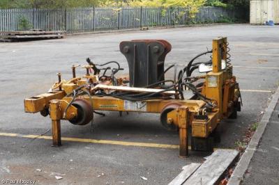 image showing a large yellow on-track machine