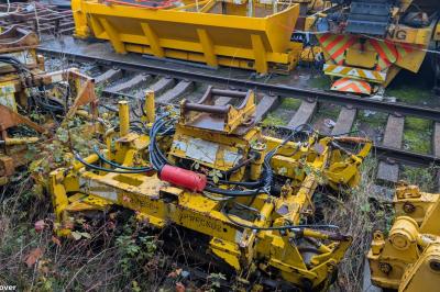 image showing a large yellow on-track machine