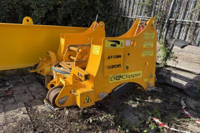 image showing a large yellow on-track machine