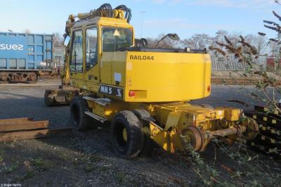 image showing a large yellow on-track machine