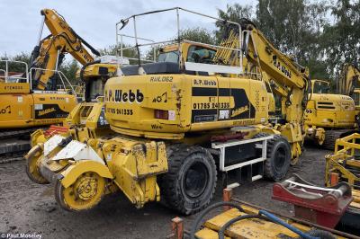 image showing a large yellow on-track machine