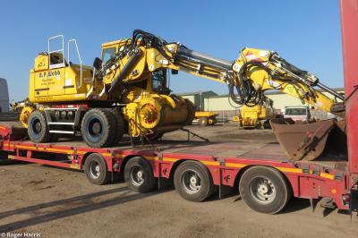 image showing a large yellow on-track machine